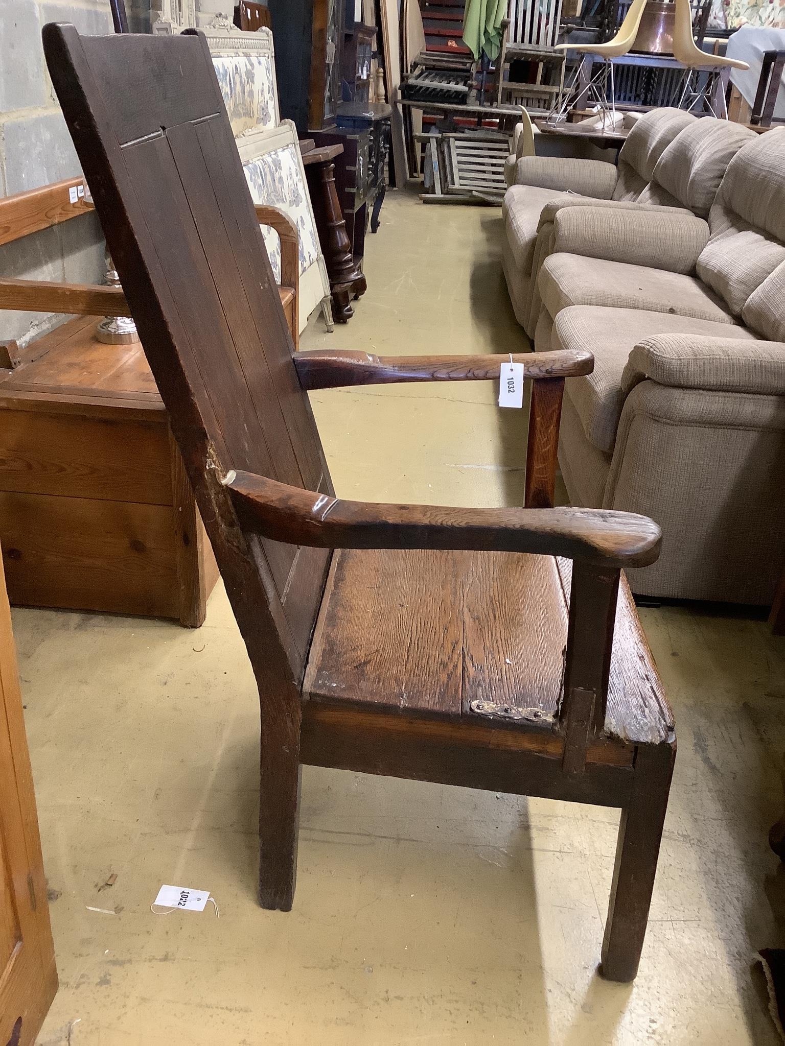 An early 18th century oak elbow chair